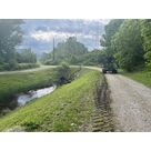 Machine de fauchage en intervention sur les bords de route